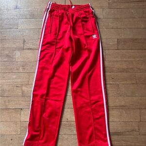 Adidas women’s Red Joggers with White Stripes